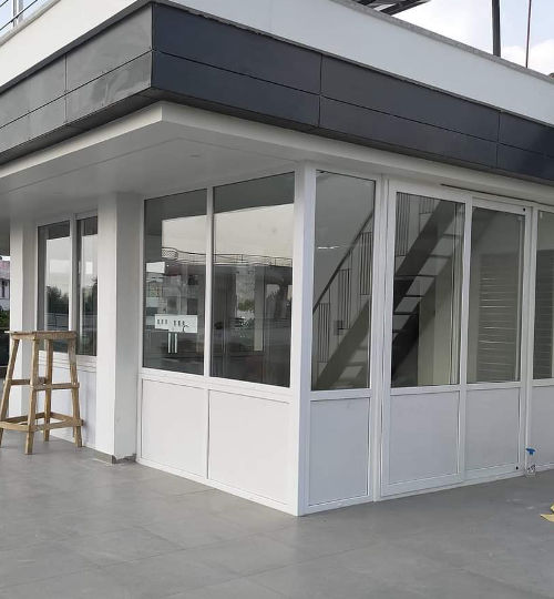 uPVC terrace enclosure installation with glass windows and doors in residential building