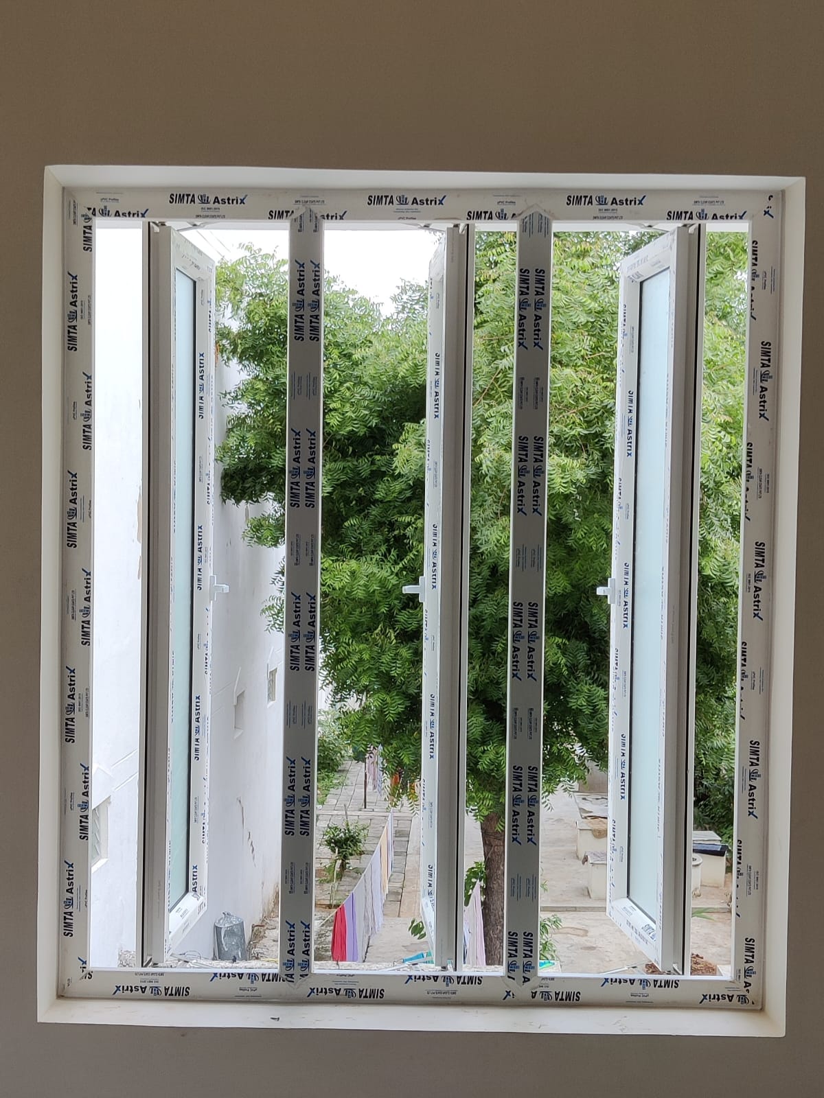 energy-efficient uPVC windows and doors fitted in house interior with outdoor greenery