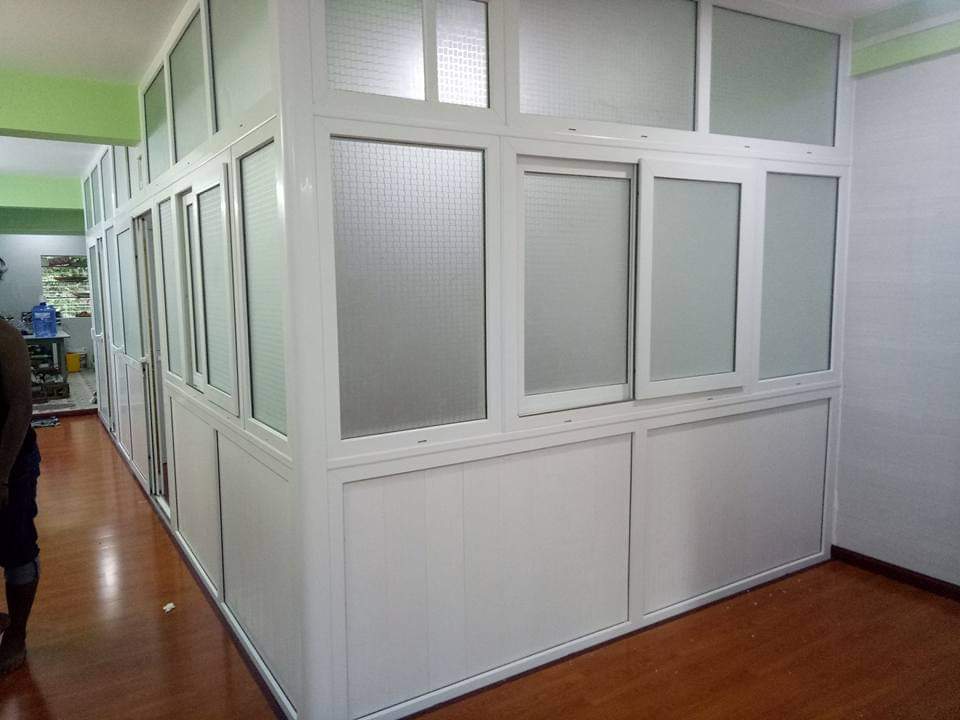 uPVC office partition installation with durable glass panels for workspace