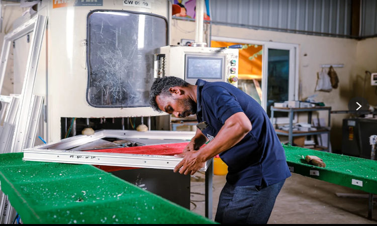 uPVC window doors manufacturing and fabrication process carried out by skilled technician in factory